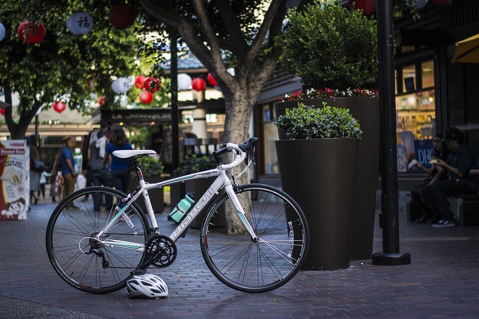 A bike and a helmet on the street