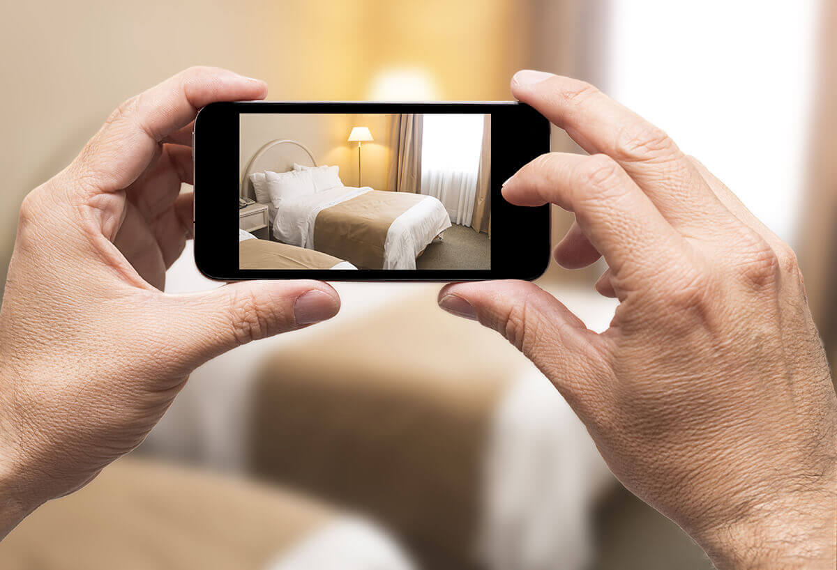 Taking a photo of a bed