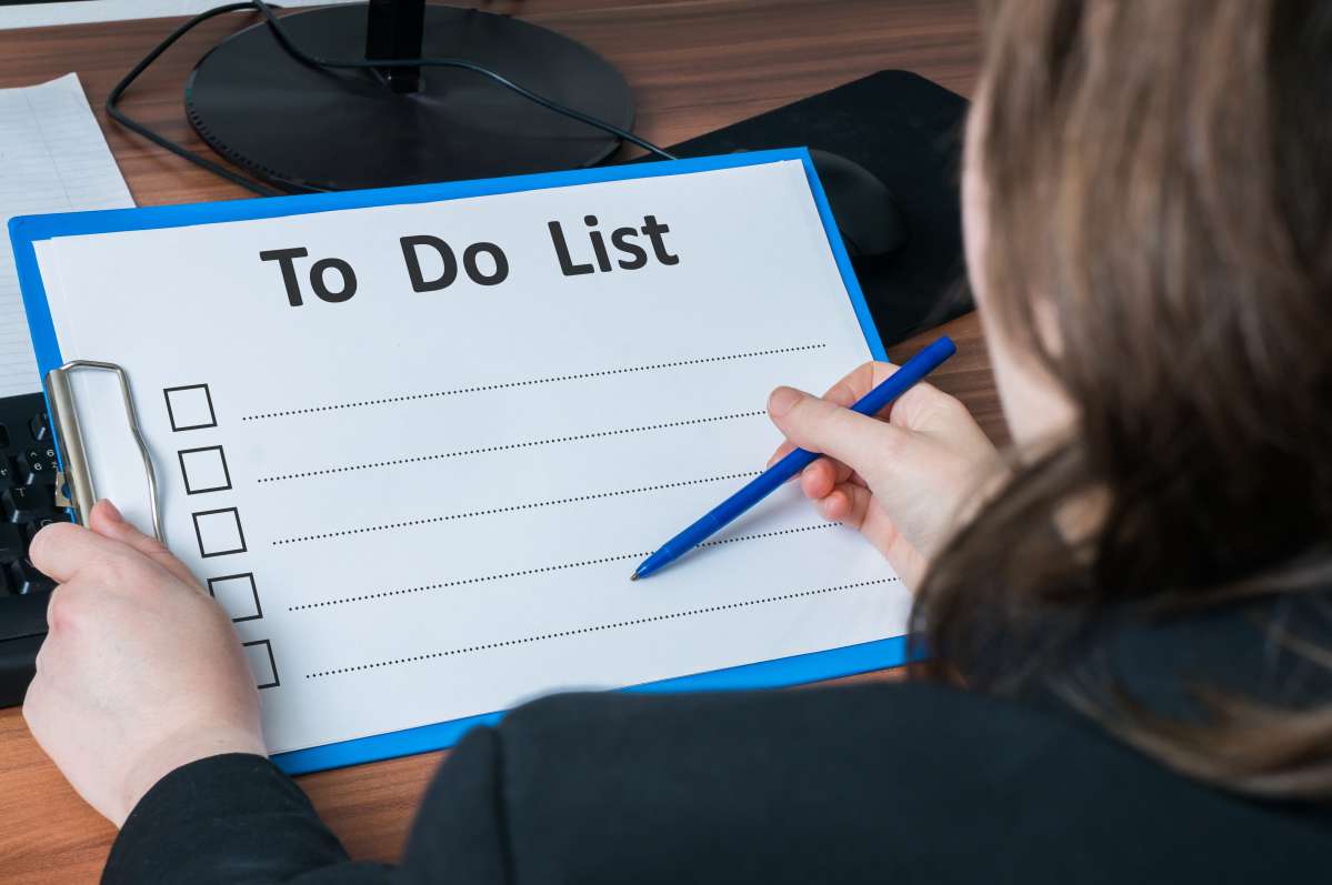 Person writing a to-do list