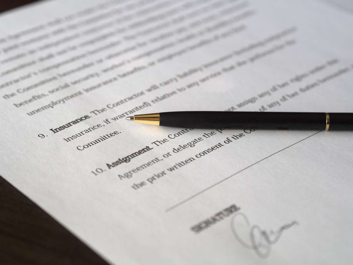 A person signing a contract with their moving company in Los Angeles