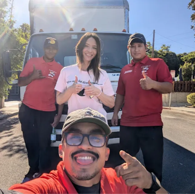 Movers holding thumbs up