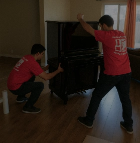 Movers moving a piano